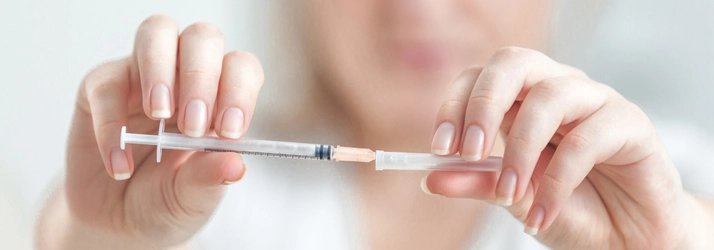 Chiropractic Mayfield Heights OH Injections A person holding an injection needle.