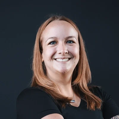Brittani Wallie smiling in a black shirt.